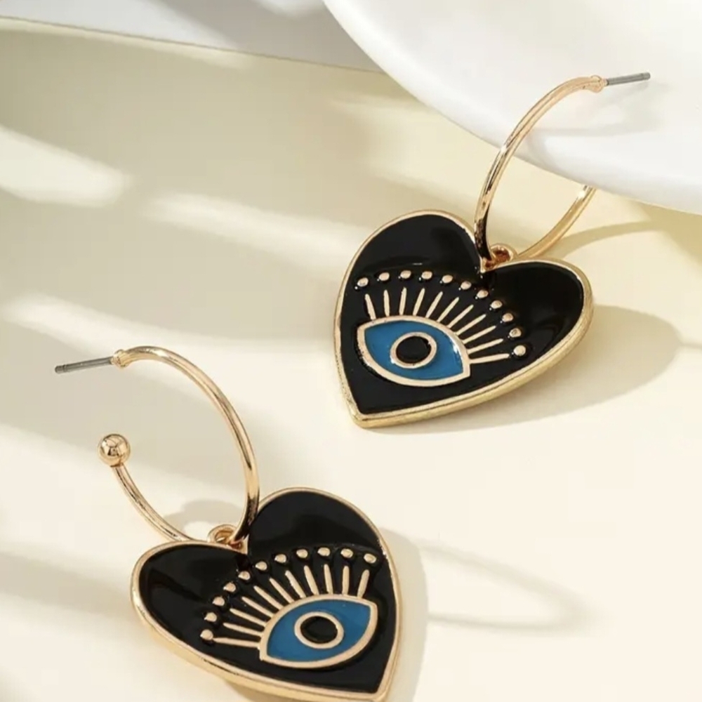 Elegant Gold and Black Heart Earrings with Eye Design